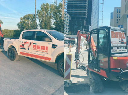 weißer pickup mit beri aufschrift auf der seite und rechts kubota bagger im einsatz